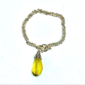 Silver toggle bracelet with yellow stone charm